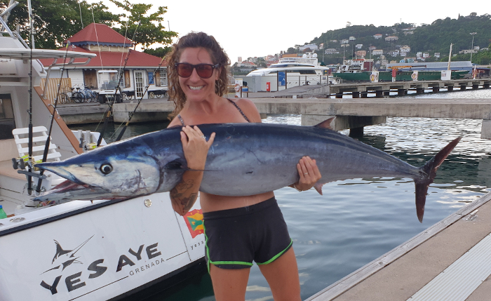 Meg with her 70lb wahoo caught along the drop off