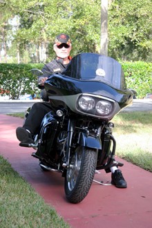 Jim Edmiston sits on his motorbike