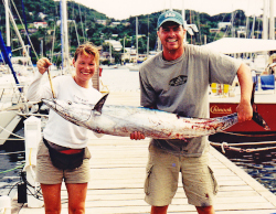 Clients holding up a 50lb wahoo they caught
