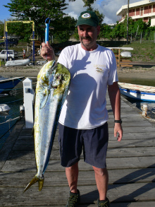 Andy Windmill holds up his dorado