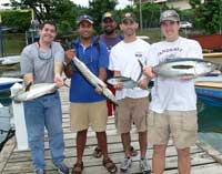 students with thier catch of blackfin tuna and barracuda
