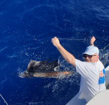 Greg holds leader on one of 2 sailfish he caught today