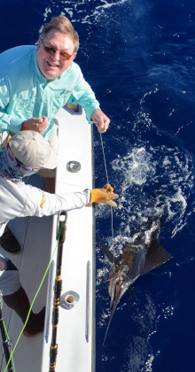 Bob looks up at the camera as George holds the leader on his sailfish