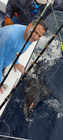 Tony with his sailfish by the boat