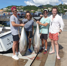 Justin et al with their 2 yellowfin tuna at the dock